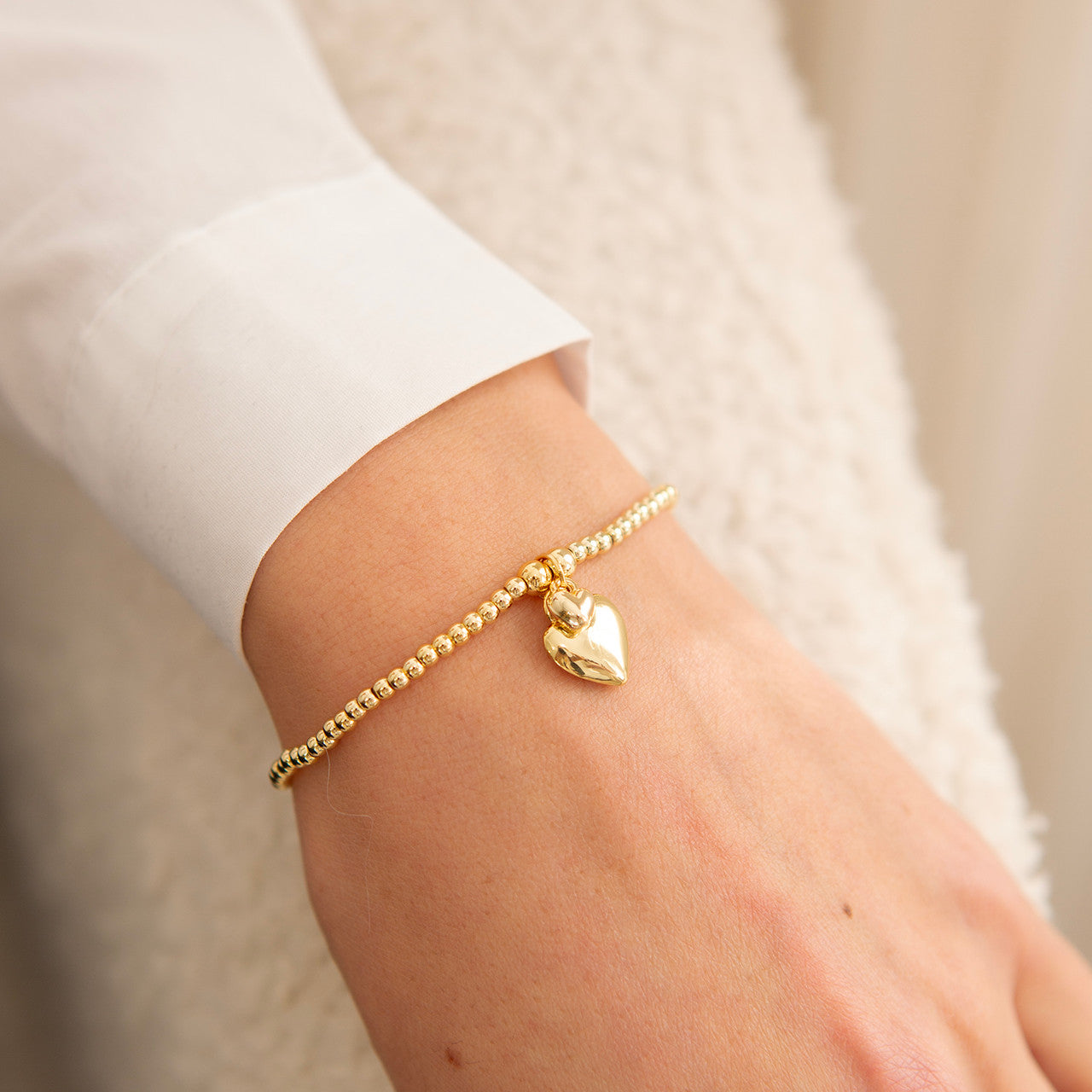 Polished puffed heart bracelet in gold