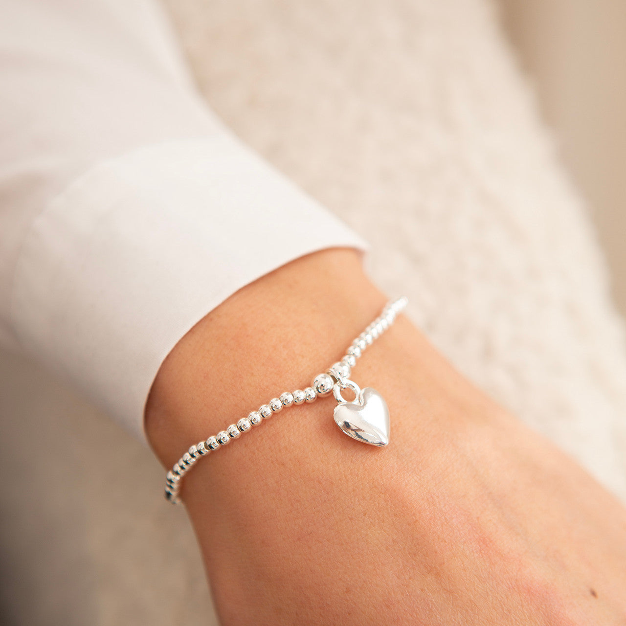 Polished puffed heart bracelet in silver