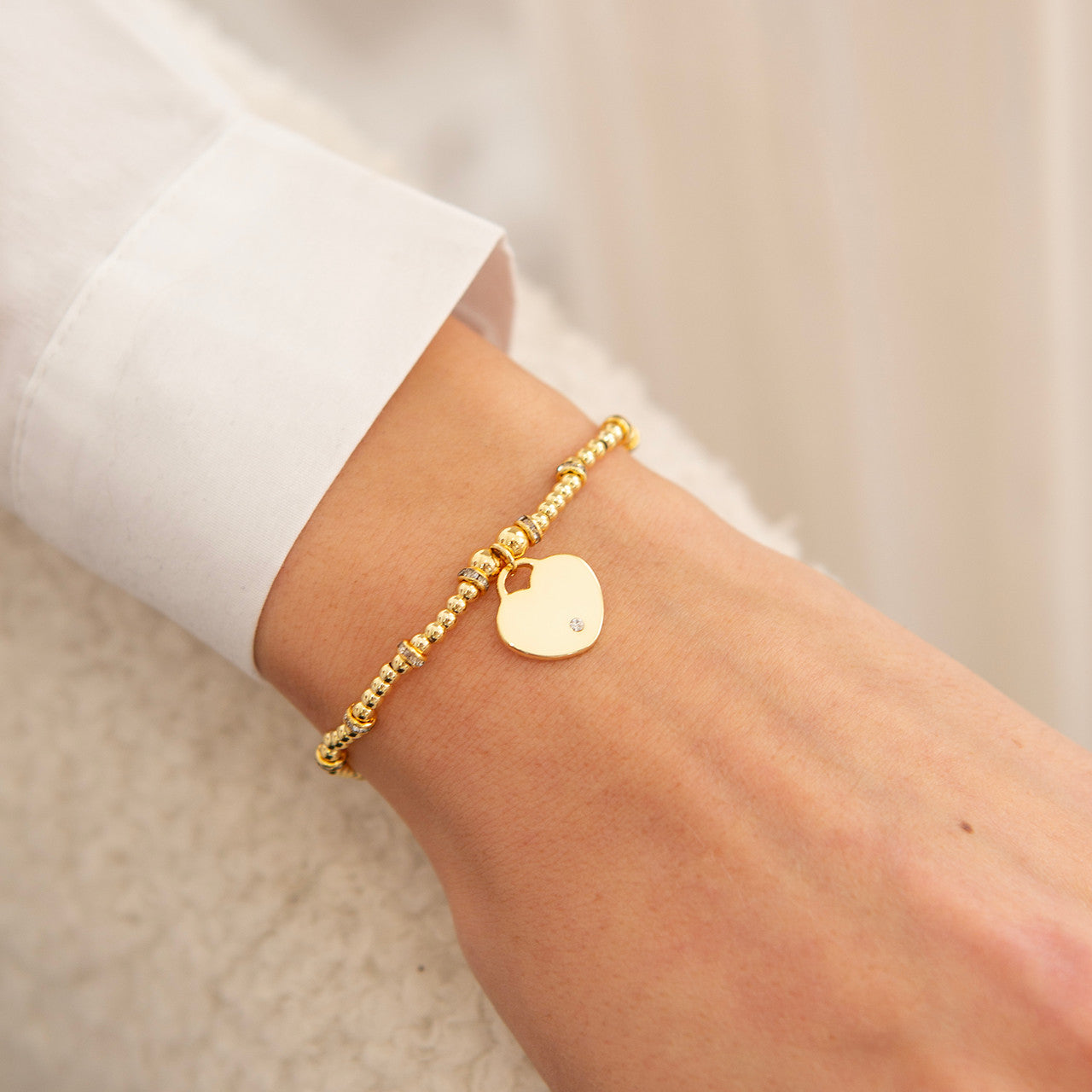 Heart with stone bracelet in gold