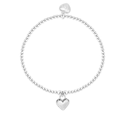 Polished puffed heart bracelet in silver