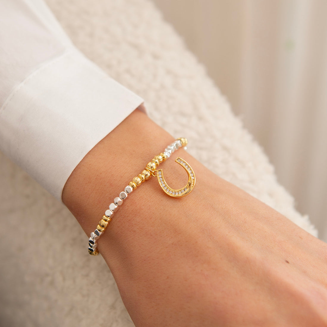 Gold horseshoe charm bracelet
