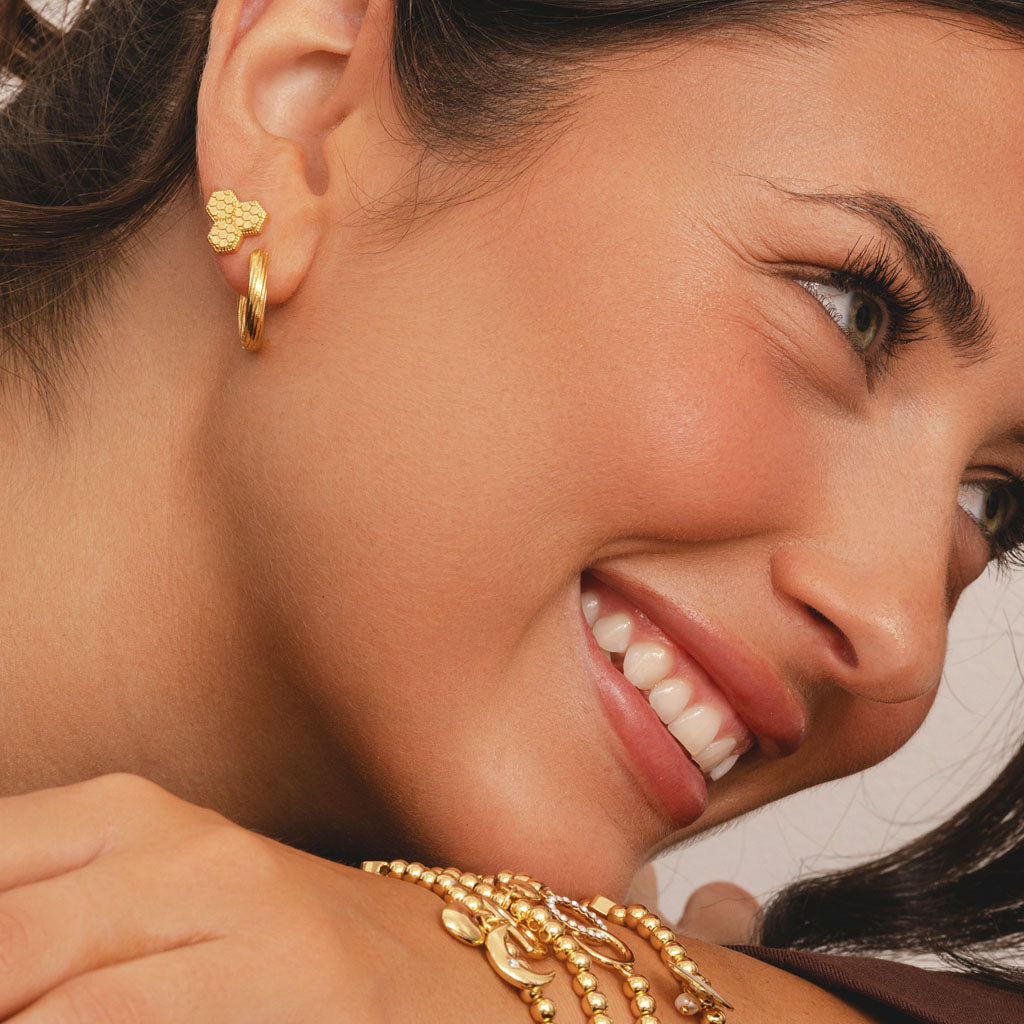 Small twisted hoop earrings in gold