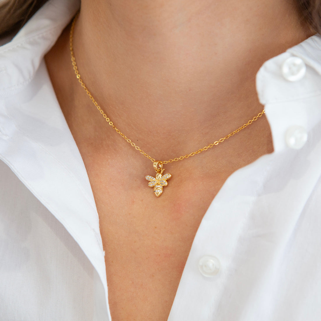 Gold bee pendant necklace