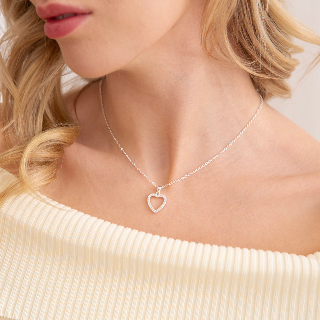 Crystal encrusted open heart pendant necklce