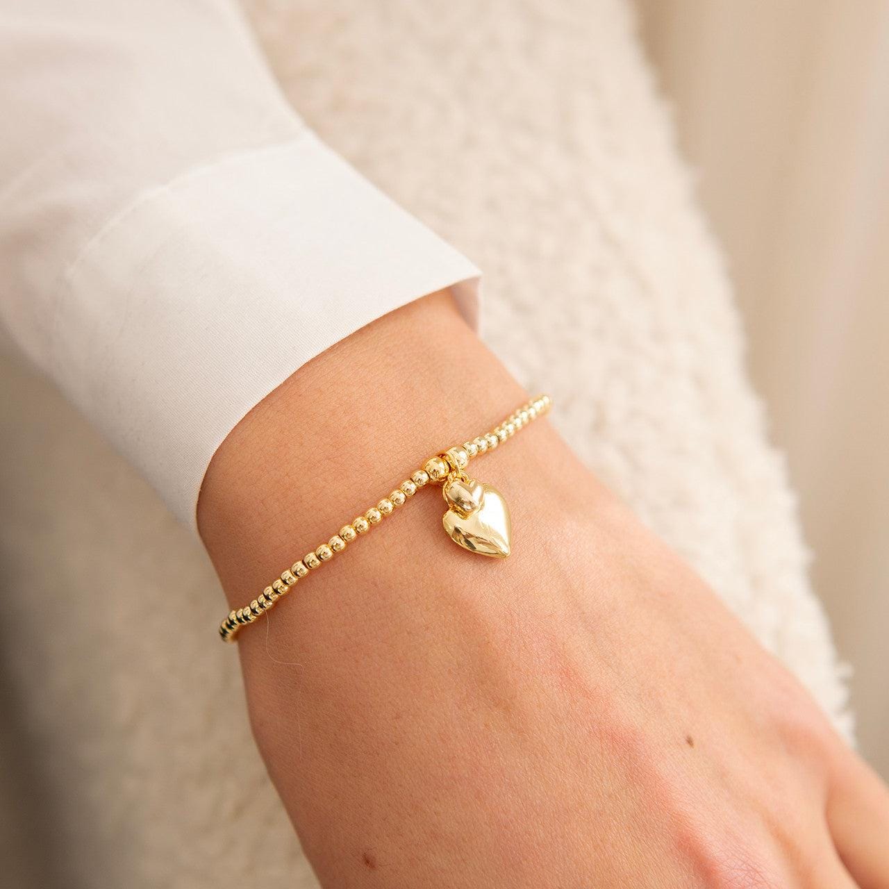 Polished puffed heart bracelet in gold