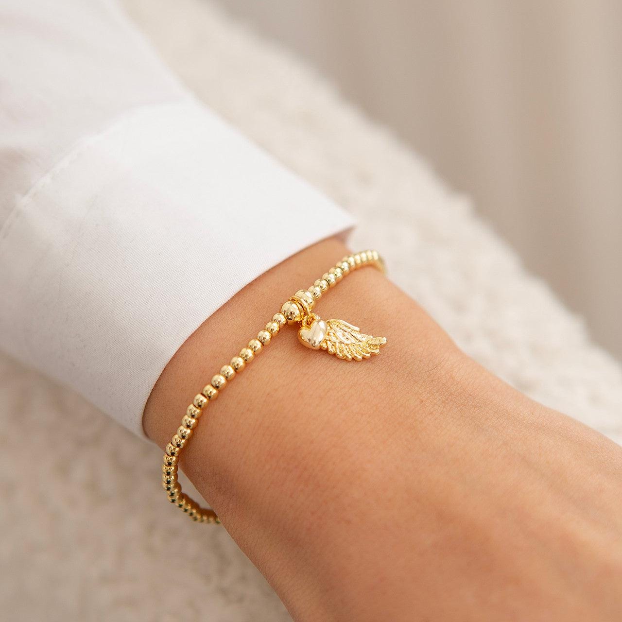 Sparkling angel wing bracelet in gold